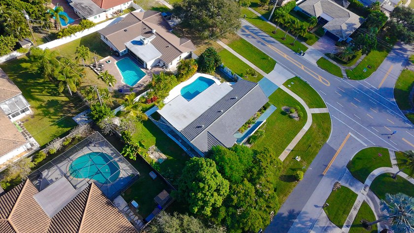 Tucked away on an oversized corner lot in the sought-after - photo 53