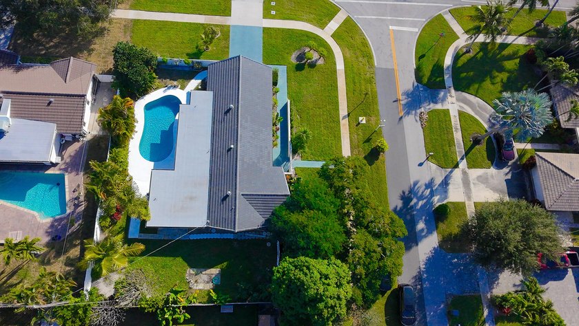 Tucked away on an oversized corner lot in the sought-after - photo 54