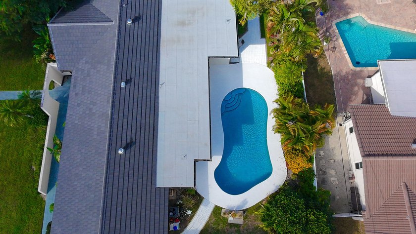 Tucked away on an oversized corner lot in the sought-after - photo 57