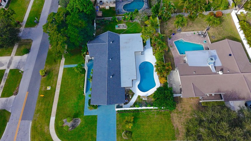 Tucked away on an oversized corner lot in the sought-after - photo 58
