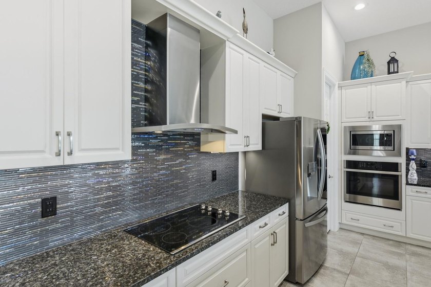 Stunning 3 bedroom home in PGA Verano. Featuring a 15x30 premium - photo 10