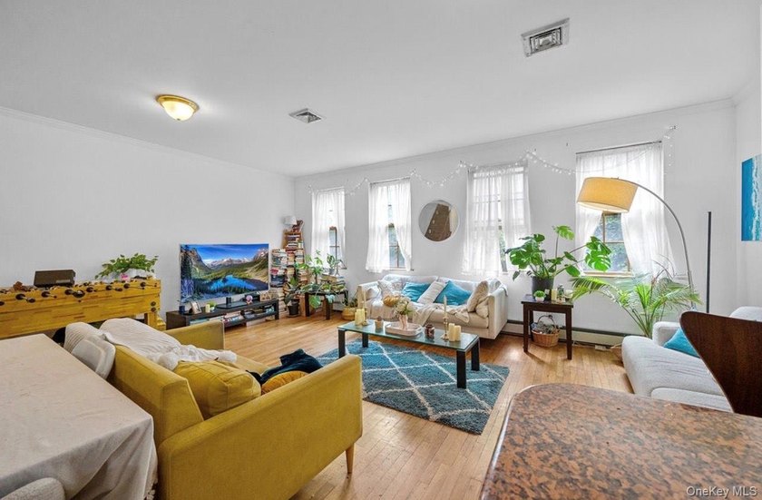 Don't miss this rare chance to own a spacious two-family home - photo 3