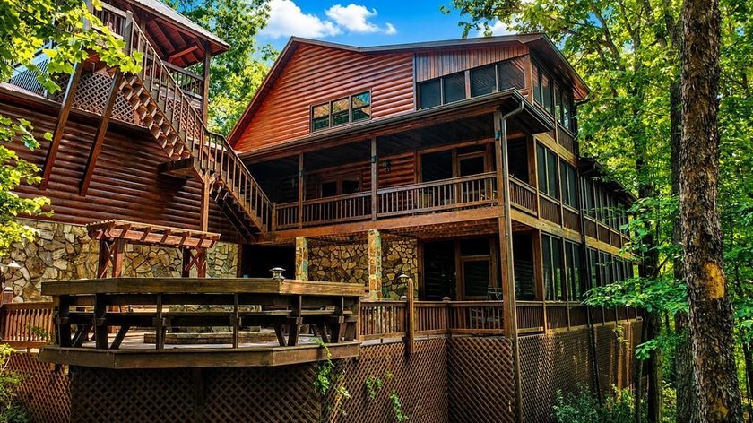 Tucked into a private wooded setting on top of the mountain in - photo 2
