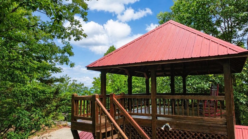 Tucked into a private wooded setting on top of the mountain in - photo 4