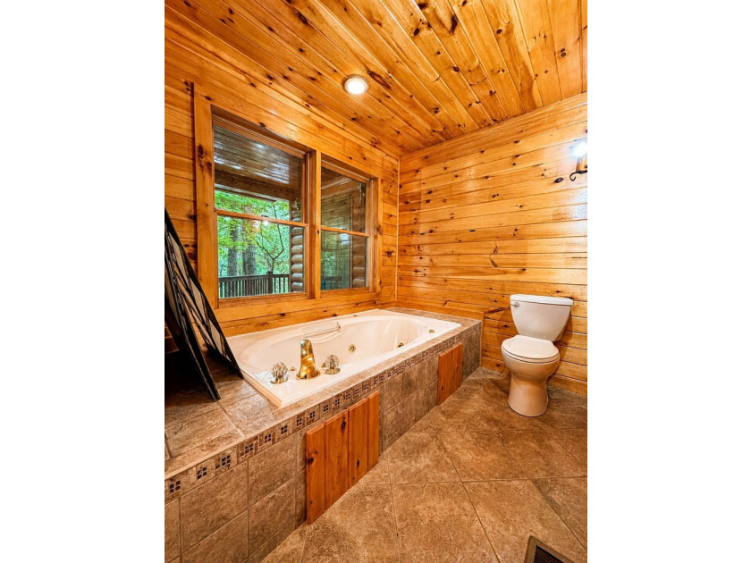 Tucked into a private wooded setting on top of the mountain in - photo 10