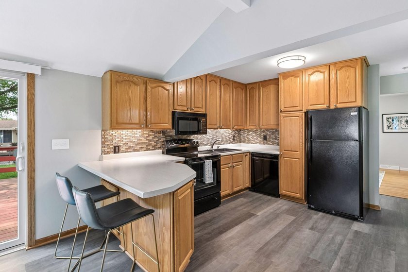 This walkout rambler is nestled on a quiet street with easy - photo 21