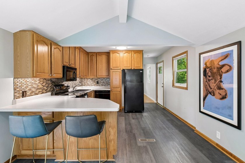 This walkout rambler is nestled on a quiet street with easy - photo 22
