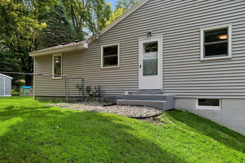 This walkout rambler is nestled on a quiet street with easy - photo 31