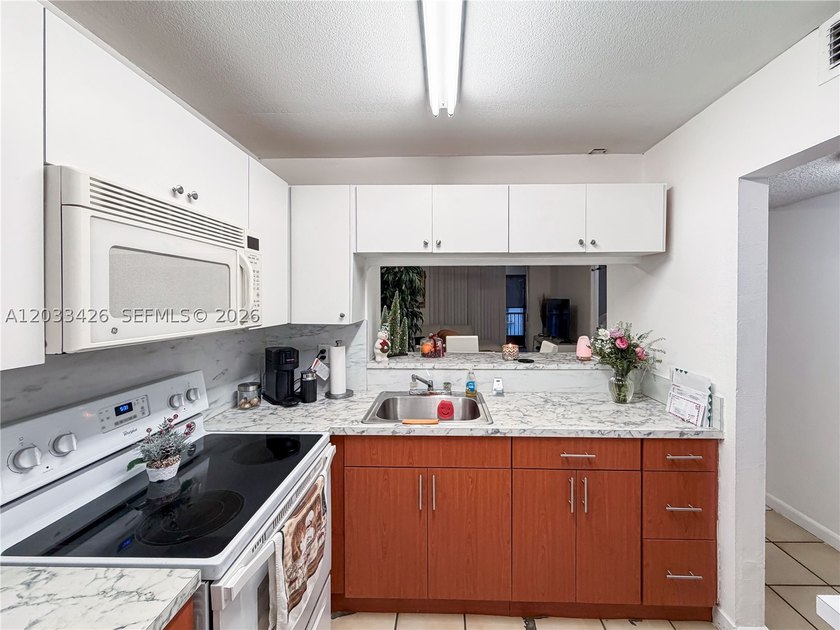 Well-maintained and spacious 2-bedroom, 2-bathroom condo located - photo 14