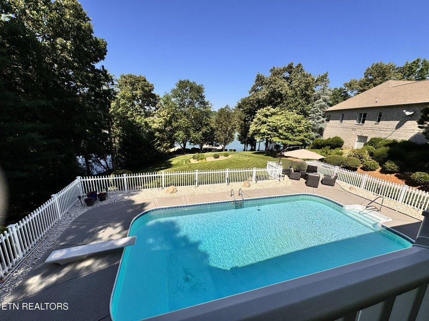 Experience exceptional lakefront living in Tellico Village with - photo 32