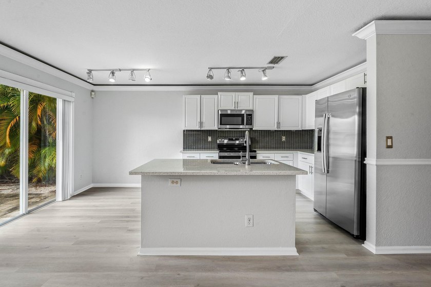 Welcome to 3260 Commodore Court, a beautifully renovated lake - photo 8