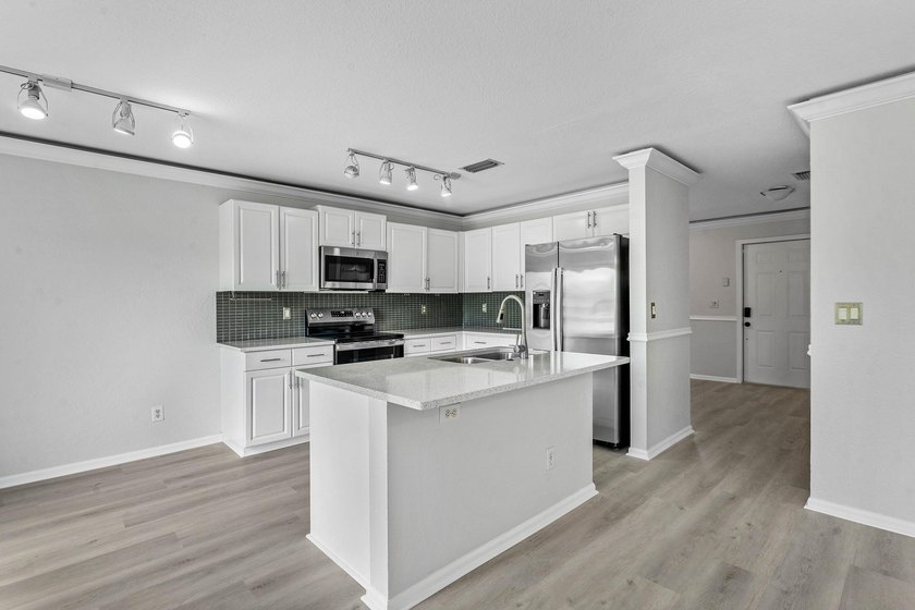 Welcome to 3260 Commodore Court, a beautifully renovated lake - photo 9