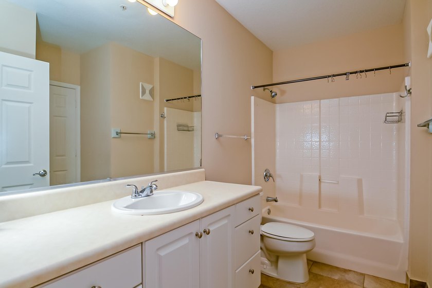 First-floor living, gated community, and the Indian River Lagoon - photo 13