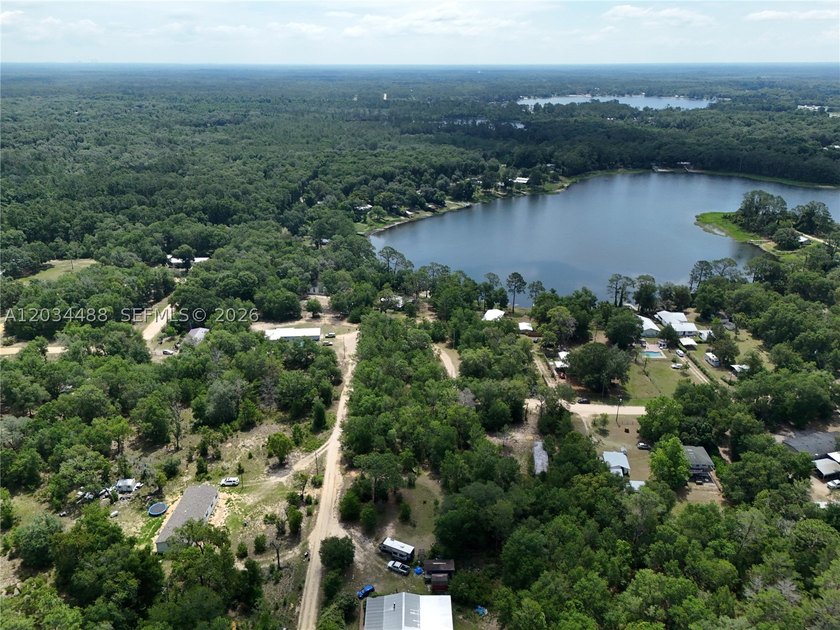 Discover the potential of this spacious vacant lot located in - photo 5