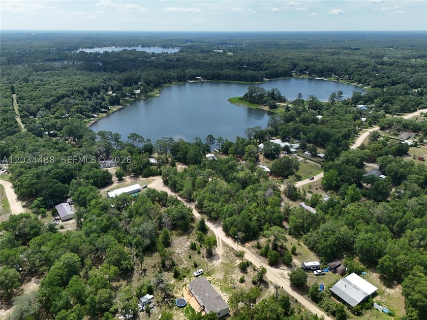 Discover the potential of this spacious vacant lot located in - photo 6