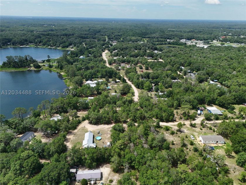Discover the potential of this spacious vacant lot located in - photo 7