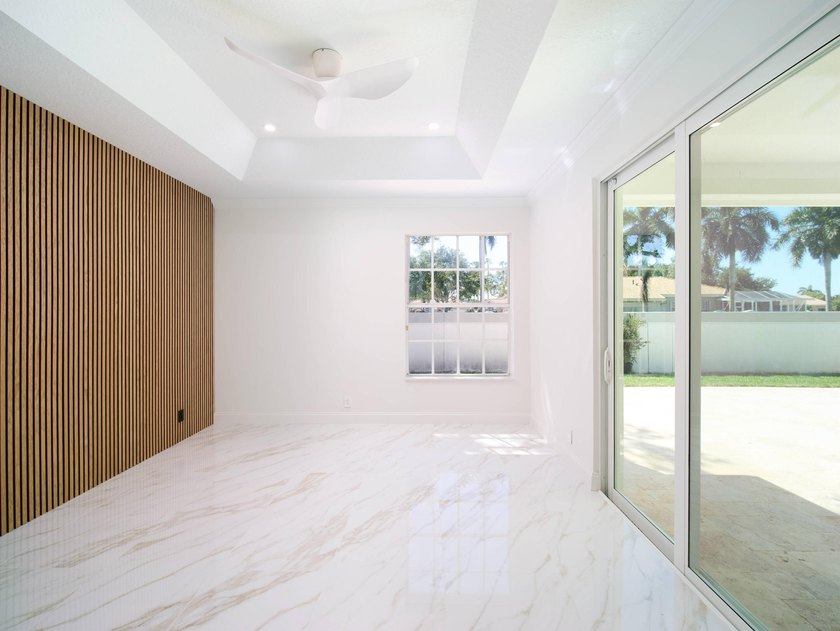 This completely reimagined 3-bedroom, 2-bath residence offers a - photo 20