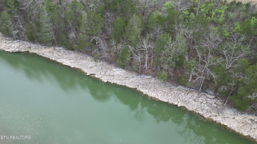 Beautiful 1.73-acre lot at the lake with 420 FEET OF - photo 8