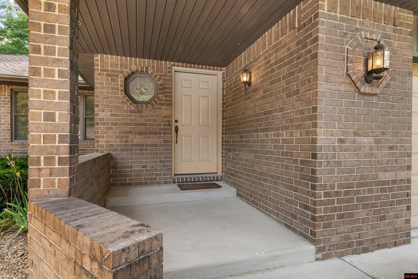 Spacious brick home on a beautiful corner lot offering over half - photo 2