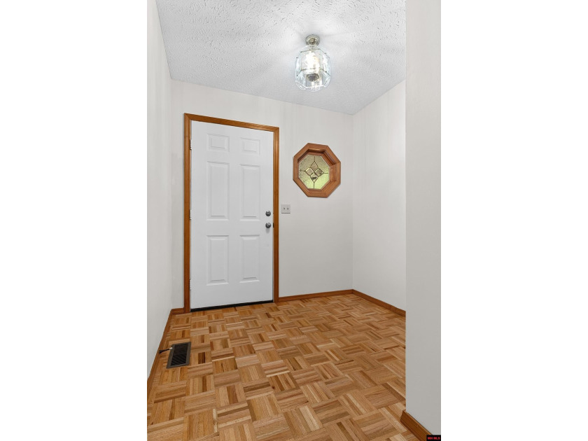 Spacious brick home on a beautiful corner lot offering over half - photo 3