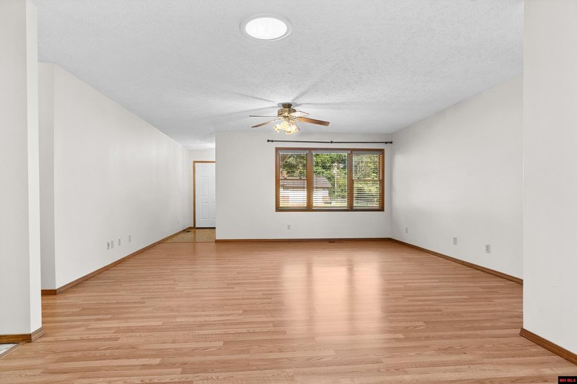 Spacious brick home on a beautiful corner lot offering over half - photo 5