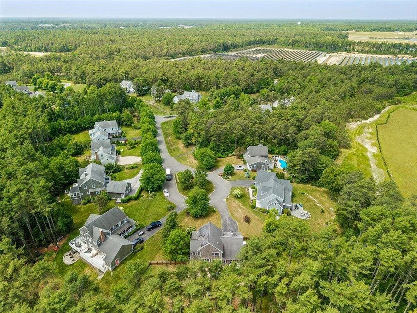 Overlooking Tihonet Pond, 22 Red Pine Lane offers a distinctive - photo 13