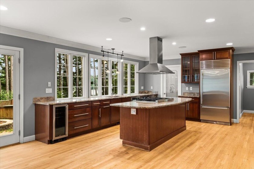 Overlooking Tihonet Pond, 22 Red Pine Lane offers a distinctive - photo 21