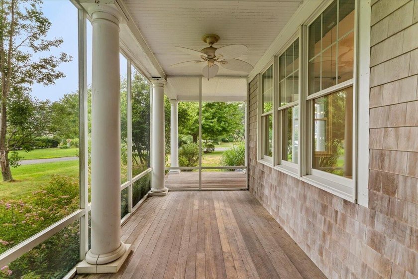 Overlooking Tihonet Pond, 22 Red Pine Lane offers a distinctive - photo 24