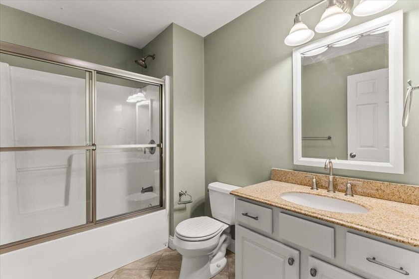 Overlooking Tihonet Pond, 22 Red Pine Lane offers a distinctive - photo 32