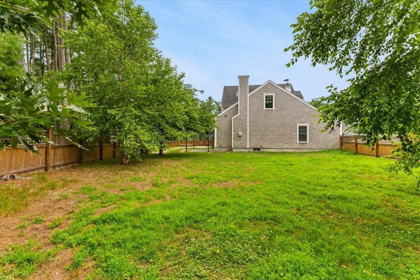 Overlooking Tihonet Pond, 22 Red Pine Lane offers a distinctive - photo 39