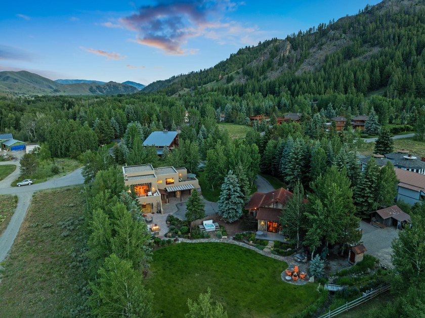 This exceptional 1.3-acre estate combines timeless architecture - photo 2