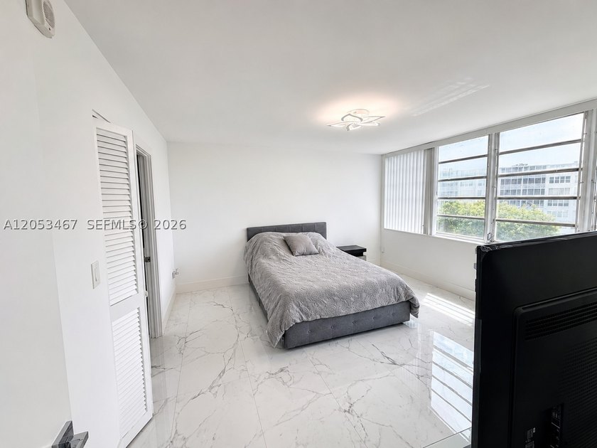 Beautifully remodeled 2-bedroom + den, 2-bath residence has the - photo 12