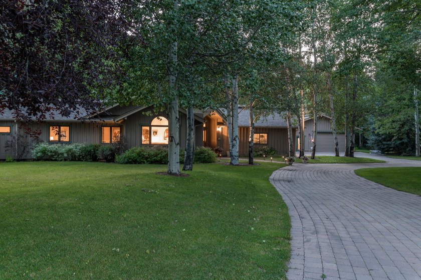 This charming home is a jewel on a mature one-acre lot. The - photo 2
