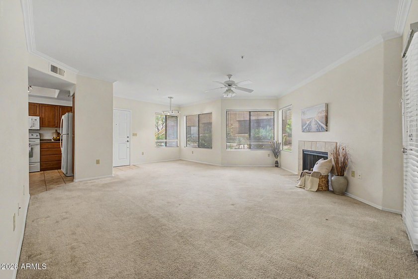 Nestled within the gated Sienna Condominiums in Scottsdale, just - photo 2