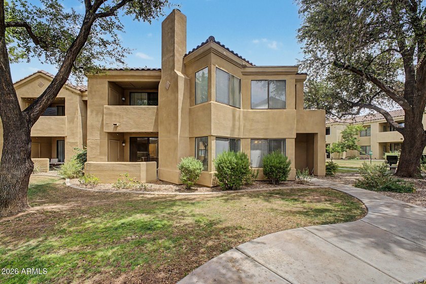 Nestled within the gated Sienna Condominiums in Scottsdale, just - photo 3