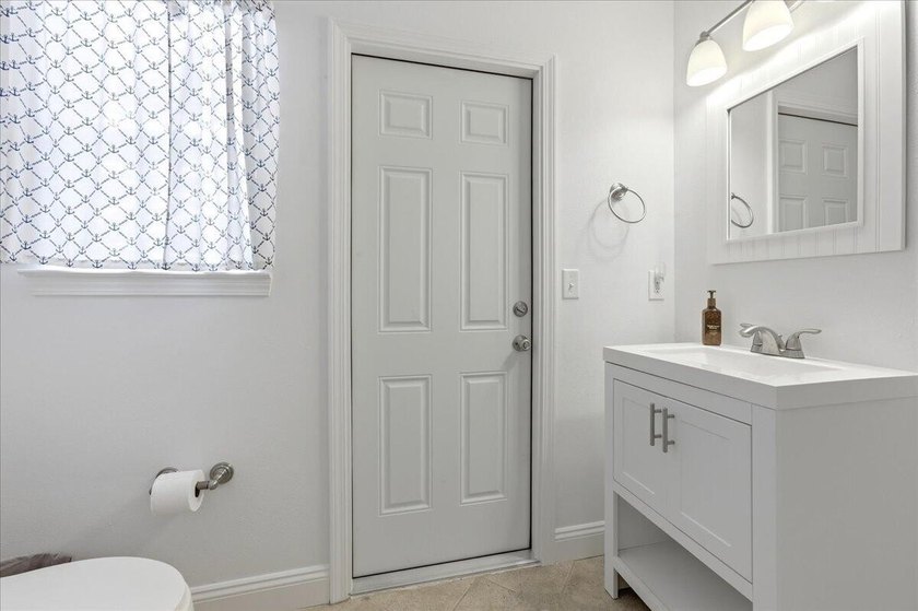 Welcome to Rocky Bayou Country Club Estates. This home offers a - photo 47