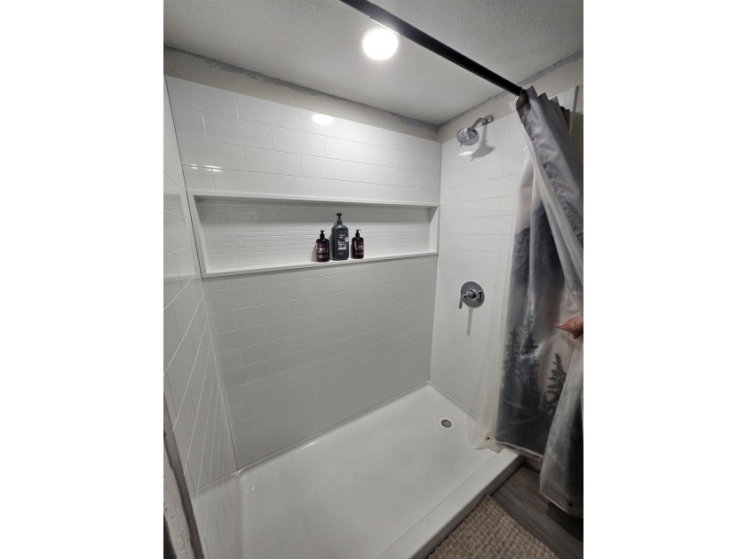 Tucked away in the gated community of Holly Lake Ranch, this - photo 32