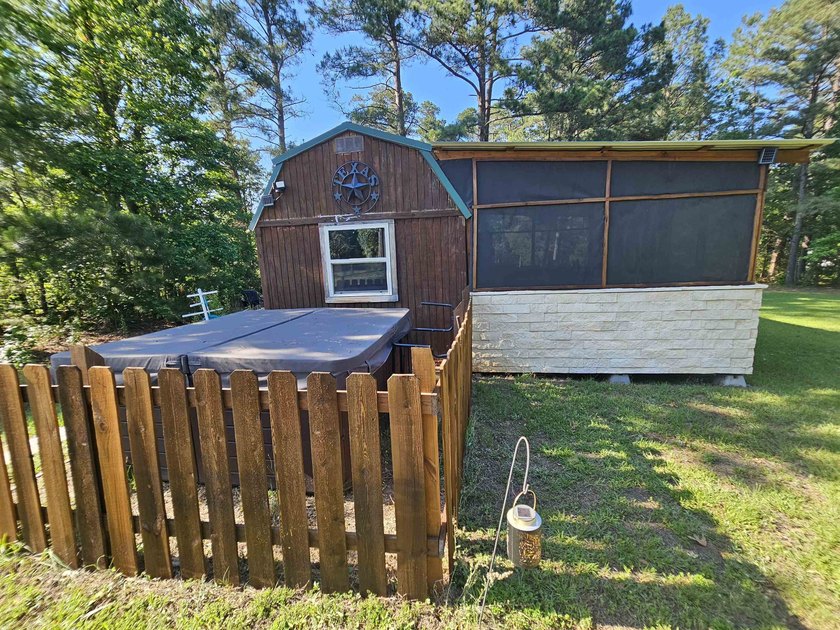 Tucked away in the gated community of Holly Lake Ranch, this - photo 46