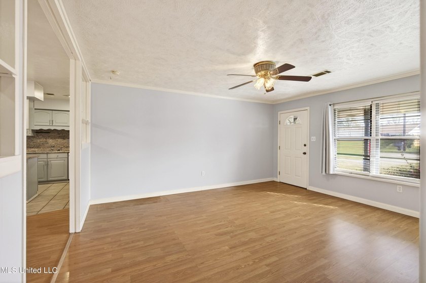 This well-maintained 3-bedroom brick home in Long Beach offers a - photo 7