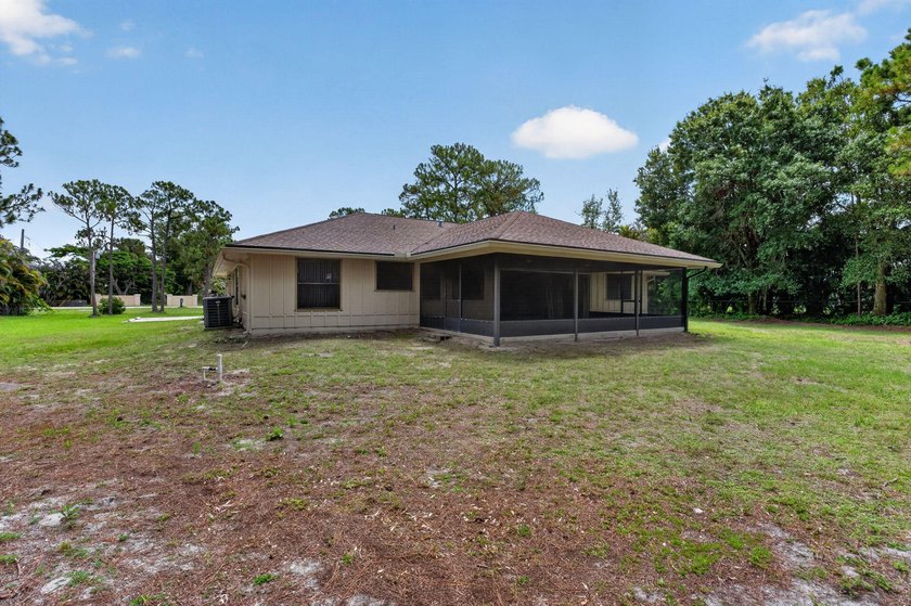 Enjoy peaceful country living in Jupiter Farms with this - photo 40