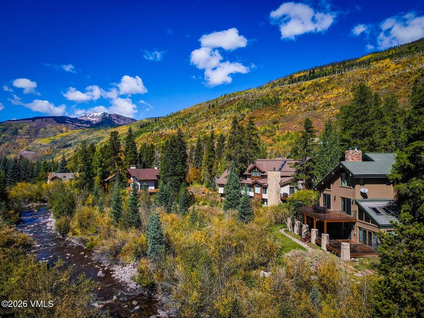 Strategically positioned along the banks of Gore Creek, this - photo 14