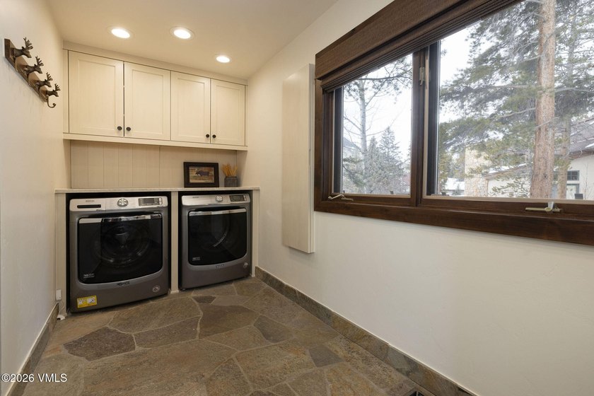 Strategically positioned along the banks of Gore Creek, this - photo 34