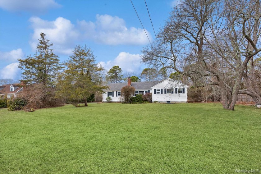 Located in the Rampasture Point section of Hampton Bays, this - photo 31