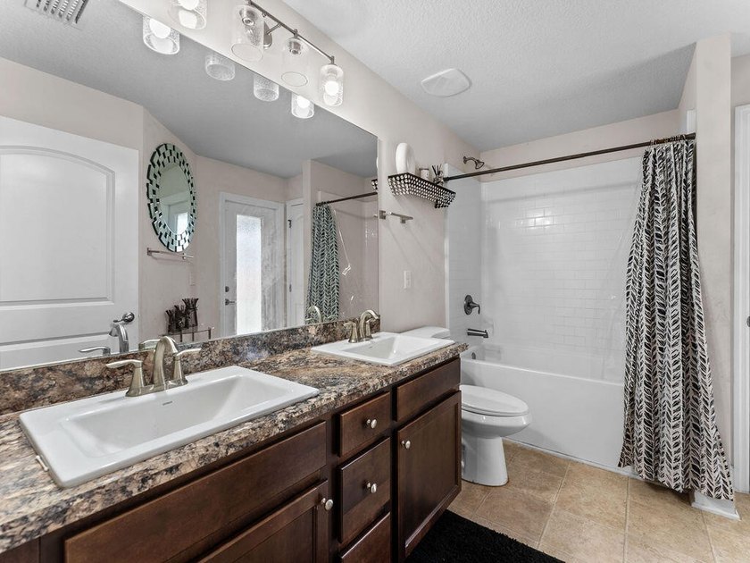 Welcome to this stunning and meticulously maintained 4-bedrm + - photo 7