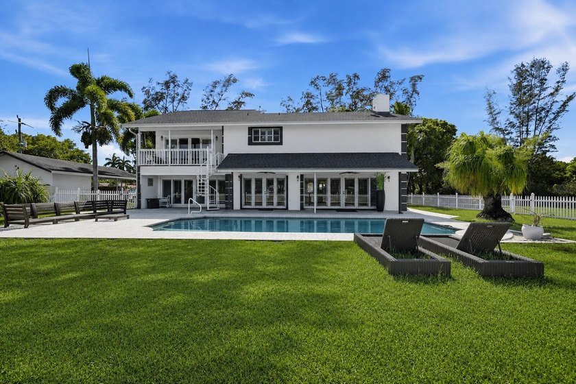 Is there a 4-bedroom home in Palm Beach County with acreage - photo 2