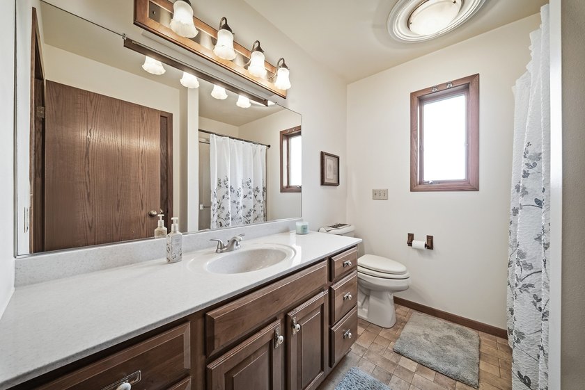 Beautifully maintained and set on a corner lot, this ranch-style - photo 23