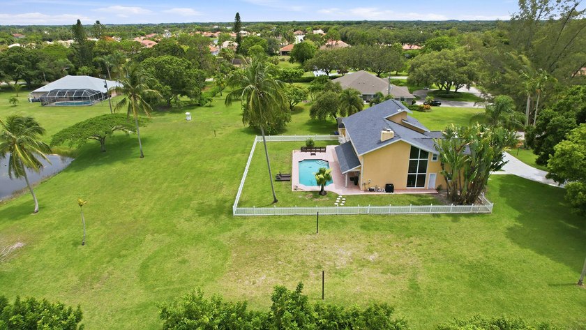 Is there a 4-bedroom home in Palm Beach County with acreage - photo 6