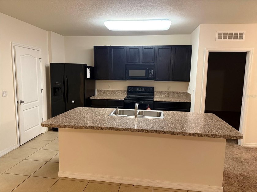 This charming 3-bedroom, 2-bath home features a spacious - photo 6
