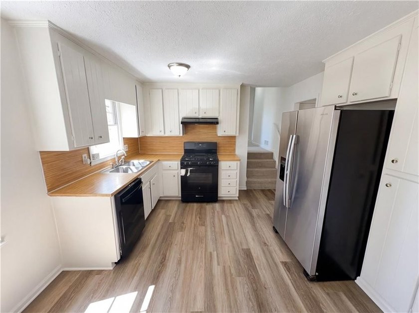 Welcome to 2006 Chelsea Ln, a home that exudes warmth and - photo 2