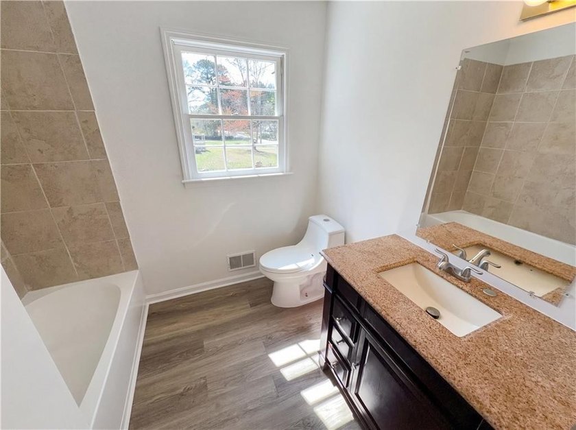 Welcome to 2006 Chelsea Ln, a home that exudes warmth and - photo 9